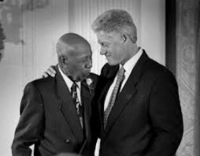 Bill Clinton greets Herman Shaw, who was a patient of the Tuskegee Experiment. http://cdn2-b.examiner.com/sites/default/files/styles/image_content_width/hash/70/1a/701a70448411344aa511c07e63292587.jpg?itok=X9vTvVTD