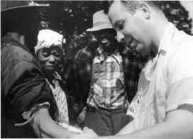 Unidentified subject, onlookers and Dr. Walter Edmondson taking a blood test (NARA, Atlanta, GA) https://upload.wikimedia.org/wikipedia/commons/3/3a/Tuskegee-syphilis-study_doctor-injecting-subject.jpg